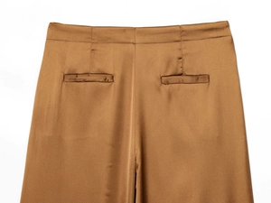 Detail view of the brown satin trousers back waist with symmetric welt pockets