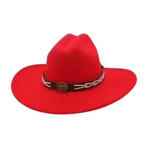 Detail of red wool felt cowboy hat featuring a brown leather band and metallic emblem