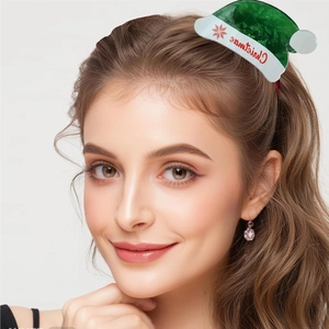 Detail of Christmas hat hair claw clip with red lettering on a green and white acrylic design