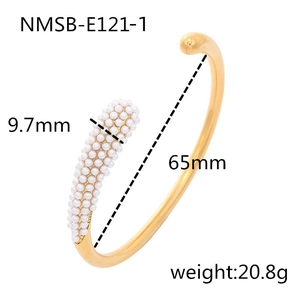 Detailed view of golden stainless steel open bangle with 65mm diameter and pearl bead end