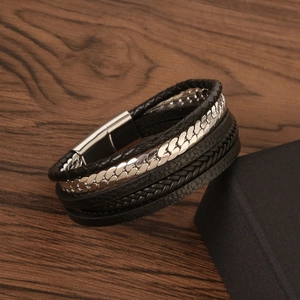 Retro multi-layer braided leather bracelet with stainless steel magnetic clasp on wood