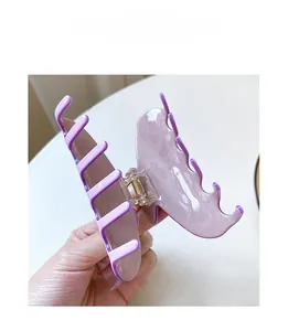 Macro detail of high-quality large acetate hair claw clip in lavender purple finish