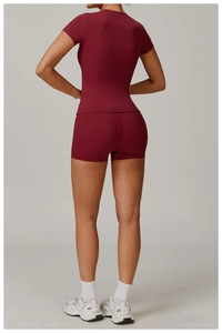 Rear view of quick-dry yoga short sleeve and matching shorts in wine red for fitness