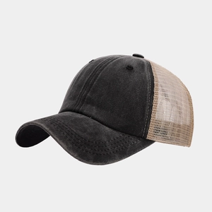 Detail view of retro washed cotton and breathable mesh panels on a stylish trucker cap