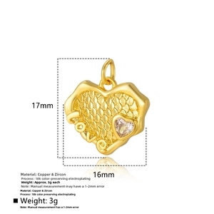 Macro shot of 18k gold plated heart pendant with zircon inlay and LOVE engraving
