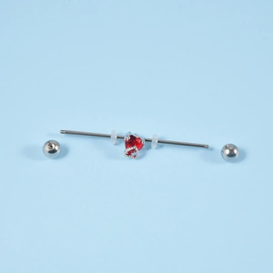 Industrial barbell earring in stainless steel with a red heart zircon and dangle heart