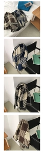 Detail of checkerboard cashmere scarves featuring classic fringes in multiple color options