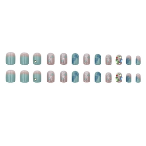 Sparkly glitter press-on nails with rhinestone accents and gradient marble design