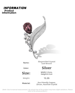 Detailed view of silver crystal leaf brooch with marquise red stone and zircon veins