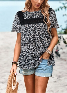 Detail of leopard print top with black lace trim on the shoulder and chest area