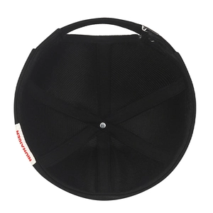 Top view of black canvas docker hat with internal mesh lining and woven side label