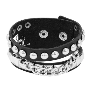Detail of punk black leather bracelets featuring silver cone studs and metal chains