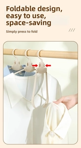 Macro detail of portable folding clothes hanger with wide non-slip shoulders for travel use