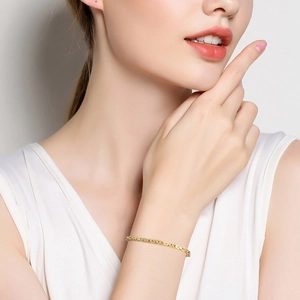 Close-up of a premium gold chain bracelet on a female wrist with minimalist style