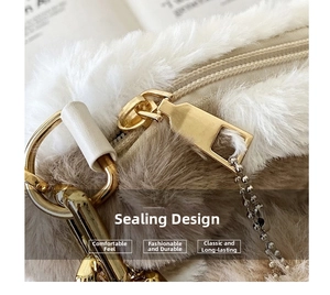 Macro detail of plush faux fur tote showing high-quality golden zipper and metal D-ring