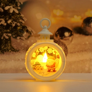 Close-up of white LED Christmas lantern with Santa pattern and warm glowing light