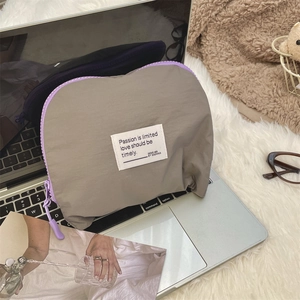 Close-up of waterproof nylon organizer bag with contrast zipper and stylish fabric label