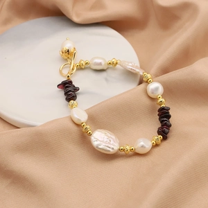 Baroque pearl and red garnet beaded bracelet with golden toggle clasp on silk