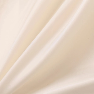 Detail of soft cream faux fur texture and smooth silk satin lining with glossy finish