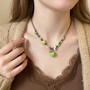 Sweet green apple beaded pendant necklace featuring star charms and forest style design