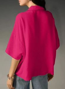 Detail showing the back and side view of a hot pink short sleeve lapel chiffon shirt