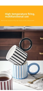 Macro detail of artistic ceramic mugs with large round handles and striped textures
