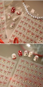 Detail of red bow and gold star nail stickers M-1362 with metallic embossing effects