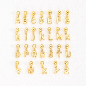 Golden 18k copper A-Z letter balloon bubble pendants set in a neat matrix layout