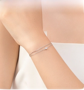 Detail of S925 sterling silver double-layer bracelet featuring a single sparkling zircon