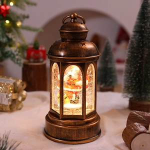 Close-up of a bronze Christmas lantern with Santa Claus figurine and glowing glitter water