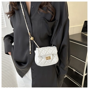 Detail of white quilted chain bag featuring golden sphere adjustment buckle and metal lock