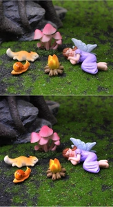 Detailed fairy garden miniature set with sleeping fairy, fox, and campfire on moss