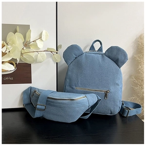 Light blue denim backpack set with cute ear details and matching adjustable crossbody bag