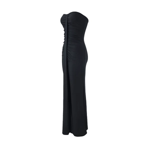 Detailed view of side rushing on a slim fit black strapless tube maxi dress