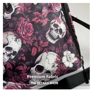Detailed view of skull and rose print on durable gothic canvas sports travel bag