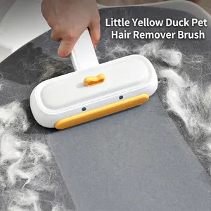 Manual pet hair remover brush for sofas and fabrics with yellow duck design accents