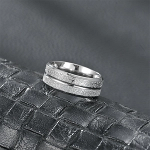 Titanium steel frosted silver ring with double-layered matte texture on leather