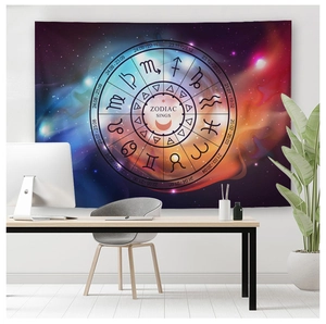 Detail of colorful zodiac tapestry with galaxy nebula print in a home office setting
