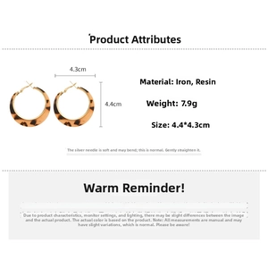 Detail of leopard print resin earrings showing 4.4cm diameter and 7.9g weight specs