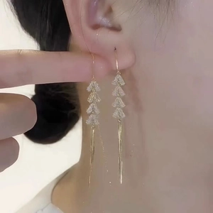 Elegant gold tassel earrings with wheat leaf design and sparkling cubic zirconia dangles