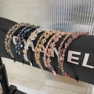Detail of six colorful crystal beaded headbands showing intricate woven craftsmanship