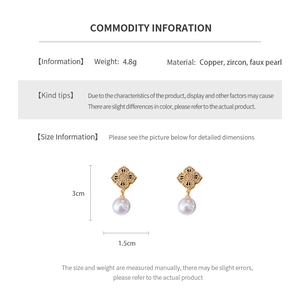 Detailed size and material specs for gold clover drop earrings with pearls and zircons