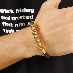 Ethnic men's braided leather bracelet with five golden stainless steel beads