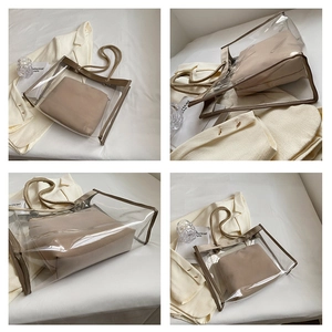 Macro view of transparent PVC tote bag with cream trim and woven cotton handles