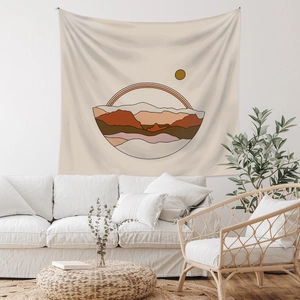 Detail view of a bohemian landscape tapestry with abstract sun and mountain on white wall