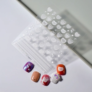 5D embossed white nail stickers with heart, bow, and lace patterns for DIY manicure