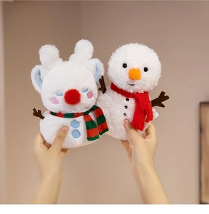Close-up of soft reindeer and snowman plush toys with festive scarves and textures