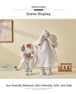 Set of two white plush Santa Claus figurines with silver sequins in a cozy home setting