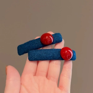 Blue knitted hair clip with red bead accents for women, stylish autumn winter hair accessory