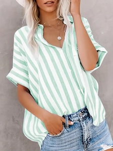 Detailed view of women's loose white and green striped short sleeve casual shirt